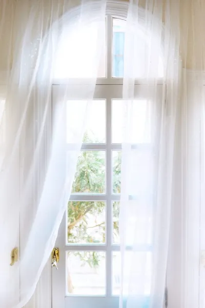 white sheer curtains as popular window coverings for bedroom