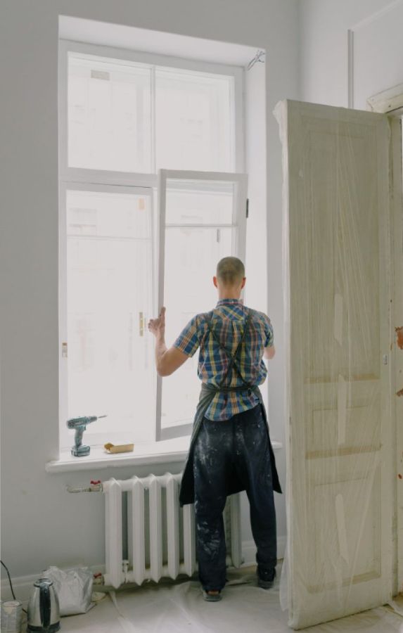 Where to place Curtain Rods is shown by the man