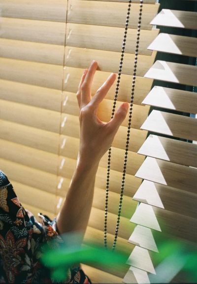 a hand showing how to How to Fix Levolor Blinds
