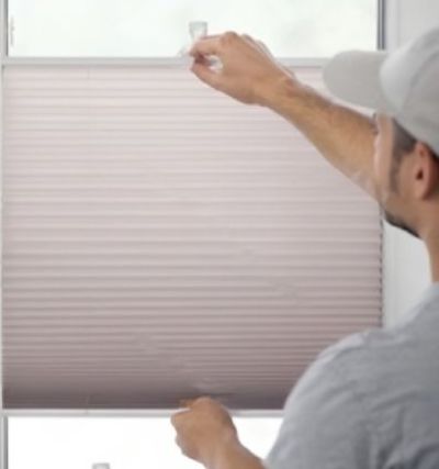 showing How to pull down blinds without strings when stuck