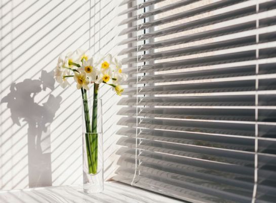 a flower vase showcasing How to Pull Down Blinds Without Strings
