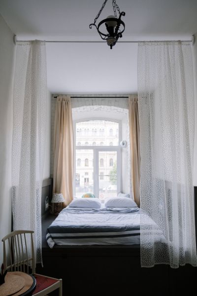 customizing drapes to the desired length in a bedroom
