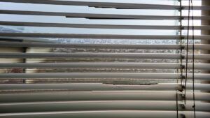 Uneven or crooked window blinds.