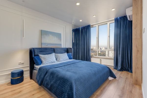 Blue Custom-made drapes ina bedroom