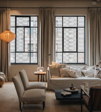 One of the essential benefits of getting window treatments is increased home value. the living room is fully furnished and windows are perfectly designed.